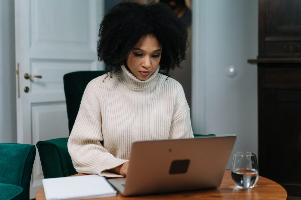 women is checking How to Find Sources for Research Paper