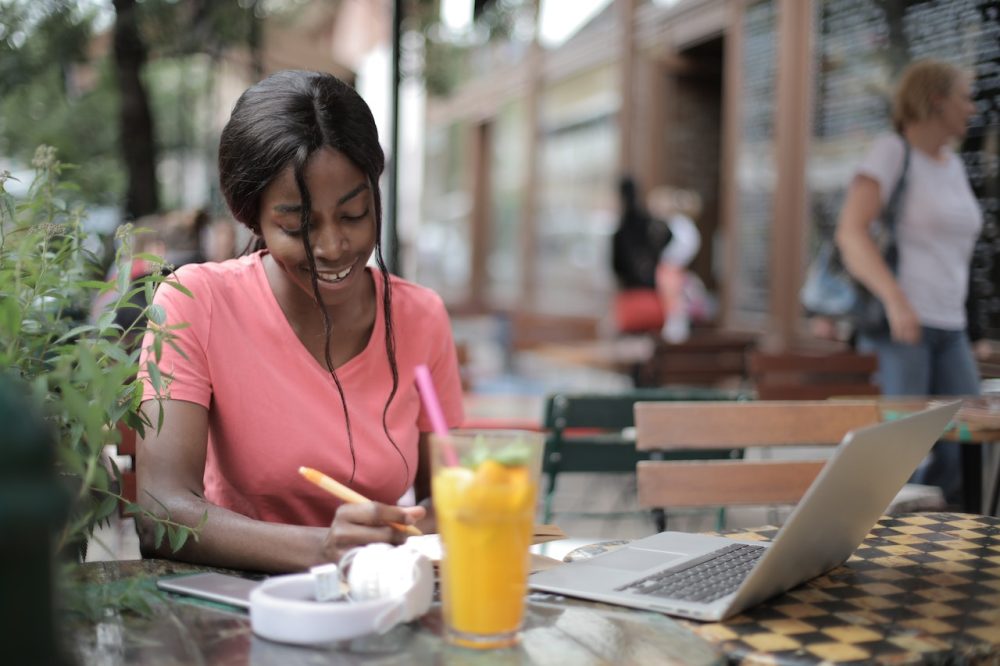 woman is writing informative essay